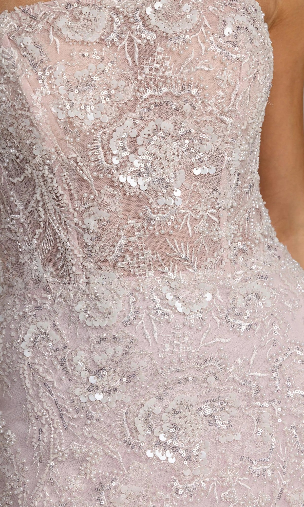 Close-up of the Mac Duggal 21147 long formal dress, a light pink strapless mermaid gown with intricate lace, sequins, and floral embroidery.